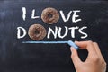 Ã¢â¬ÅI love donutsÃ¢â¬Â concept with tasty chocolate donut on dark background Royalty Free Stock Photo